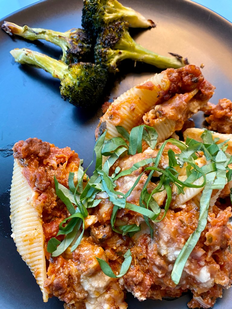 Delicious and healthy Cheesy Stuffed Shells the whole family will love! This easy weeknight dinner is great for LEFTOVERS! Which means, cook once, and enjoy all week! #food #family #recipes #pasta #italian #healthyfood #dinner 