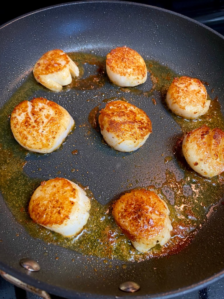 This is the BEST date night dinner! Pan seared scallops are paired with the most delicious acorn squash mash, making for a gorgeous, low carb and KETO feast! Truly restaurant quality! #food #glutenfree #dinner #keto #lowcarb #healthyfood #recipe #datenight #scallops #seafood