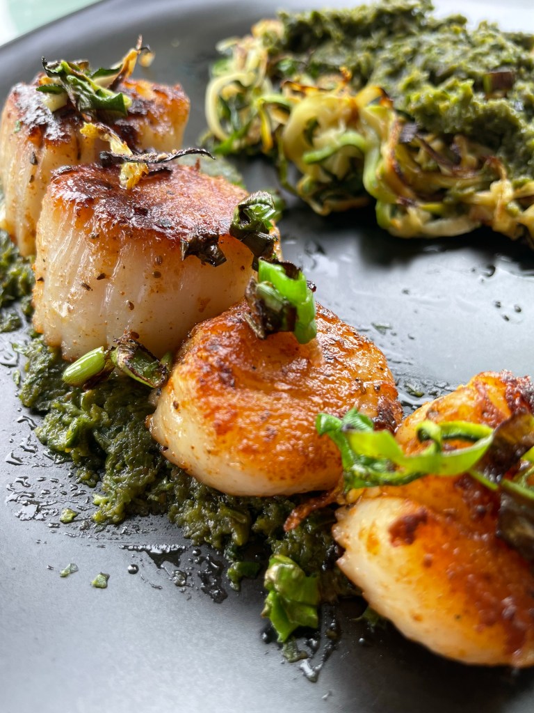 The most delicious, fast and easy dinner! Scallop Pesto Pasta! Pan seared scallops with zucchini noodles, tossed with homemade pesto — a keto and paleo dinner of dreams! Gluten free and dairy free too! #food #keto #edrecovery #cooking #recipe #paleo #pesto #glutenfree #healthyfood #cleaneating 