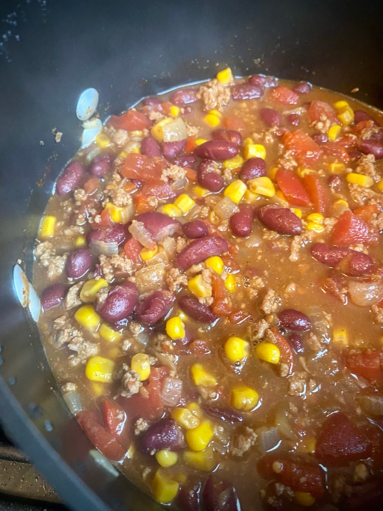 Hearty and delicious Turkey Chili! The perfect dinner for #fall! High in protein, and high in flavor! Plus you can make it in under an hour! #chili #recipe #food #dinner #family #cooking #healthy #comfortfood #quickdinner