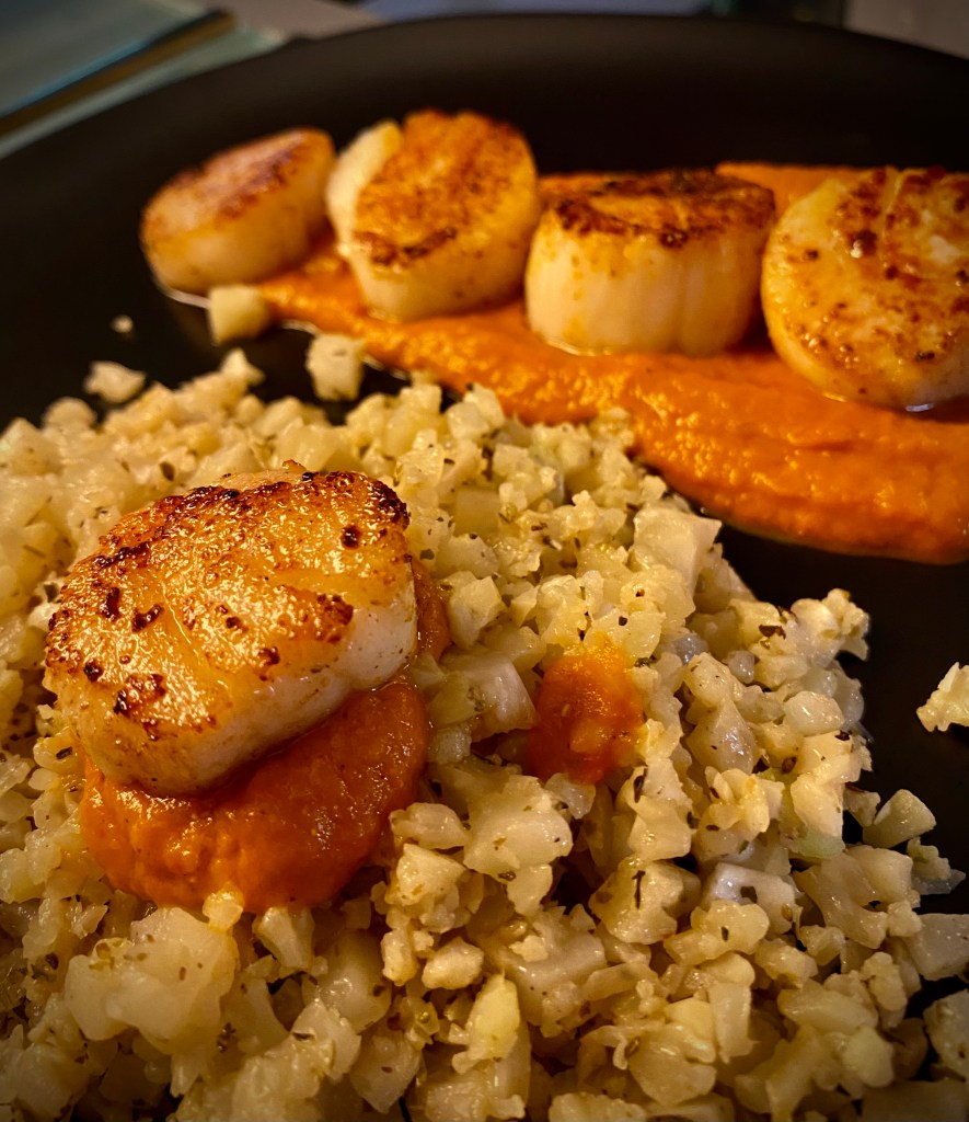 DATE NIGHT, ELEVATED! Scallops Diavolo! Italian for “devil,” this spicy red sauce pairs perfectly with pan seared scallops and cauliflower rice! This super EASY and delicious keto recipe is gorgeous, healthy, and FAST! #food #healthyfood #cooking #scallops #keto #paleo #lowcarb #glutenfree #datenight #dinner