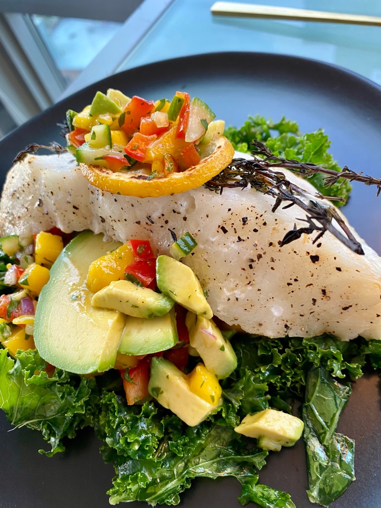 Need to “wow” someone with your cooking skills? THIS IS THE RECIPE! Chilean Sea Bass with Mango Salsa! This gluten free and paleo recipe is a crowd pleaser! Perfect for a dinner party, is make-ahead friendly and super fast and easy! PLUS ITS DANG DELICIOUS! #food #cooking #healthyfood #paleo #kale #edrecovery #recipe #health #dairyfree #dinner