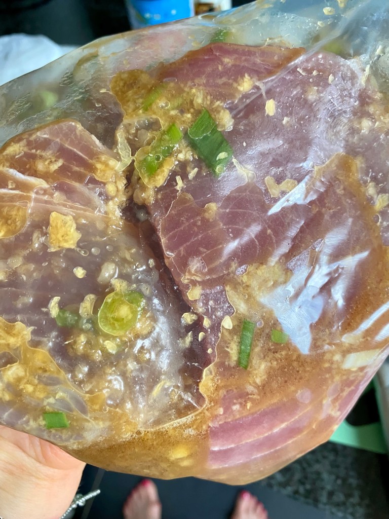 A healthy and outrageously delicious Ginger Garlic Ahi Tuna! Marinated in a delicious sauce of thai-flavors, this dish melts in your mouth! Packed with protein and ZERO CARBS, this quick and easy recipe will be your new favorite keto dinner! #keto #paleo #glutenfree #lowcarb #healthy #edrecovery #anorexia #dinner #recipe #healthyfood 
