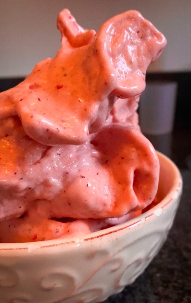 Iconic Dole Whip, recreated! My Strawberry Dole Whip is a healthy dessert you’ll want to make again and again! The whole family will love this frozen sweet treat! Made from frozen fruit! #dolewhip #food #vegan #dessert #recipe #healthyfood #glutenfree #sugarfree #vegetarian #dairyfree
