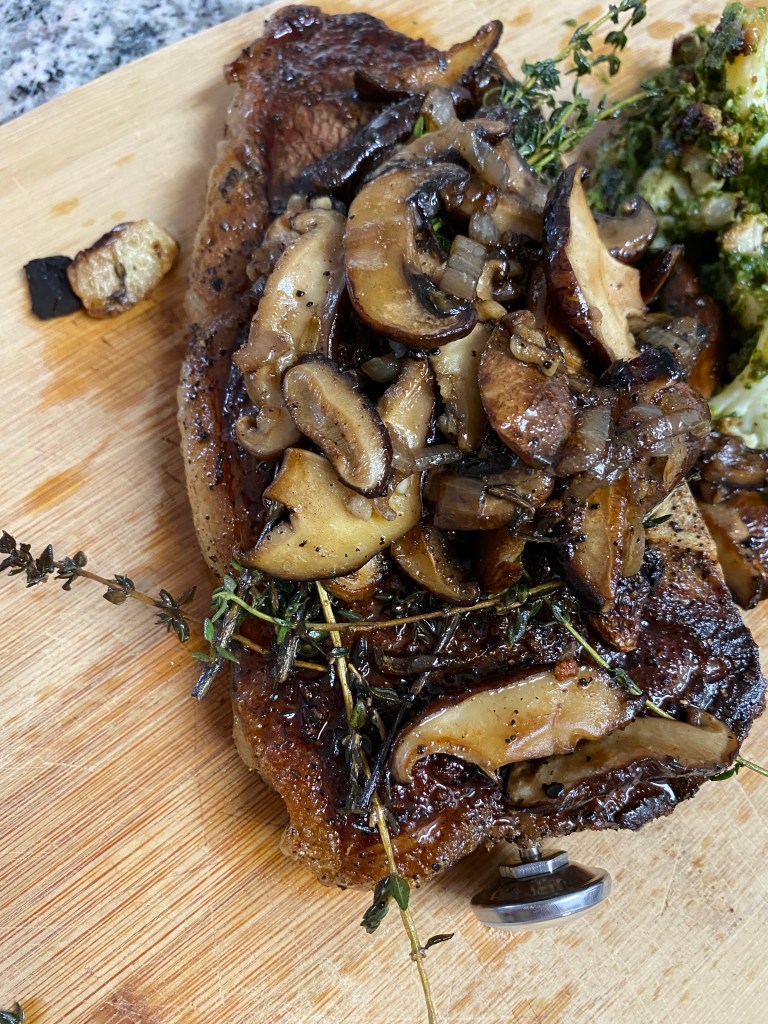 THE PERFECT STEAK! Basted with butter, thyme and garlic and seared to perfection!! Paired with pesto cauliflower, this keto date night dinner will blow you away! #glutenfree #paleo #keto #lowcarb #steak #cooking #edrecovery #food #recipes 