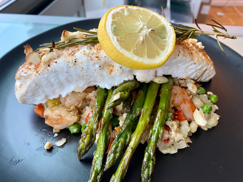 A healthy and delicious KETO dinner! Amazing fried rice made from CAULIFLOWER! It may be low carb, but this meal is high flavor! Bursting with meaty shrimp and juicy pineapple, this quick and easy meal will become a family favorite! #keto #food #paleo #glutenfree #grainfree #shrimp #edrecovery #friedrice #recipe #yum