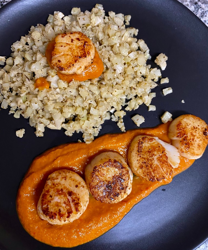 DATE NIGHT, ELEVATED! Scallops Diavolo! Italian for “devil,” this spicy red sauce pairs perfectly with pan seared scallops and cauliflower rice! This super EASY and delicious keto recipe is gorgeous, healthy, and FAST! #food #healthyfood #cooking #scallops #keto #paleo #lowcarb #glutenfree #datenight #dinner