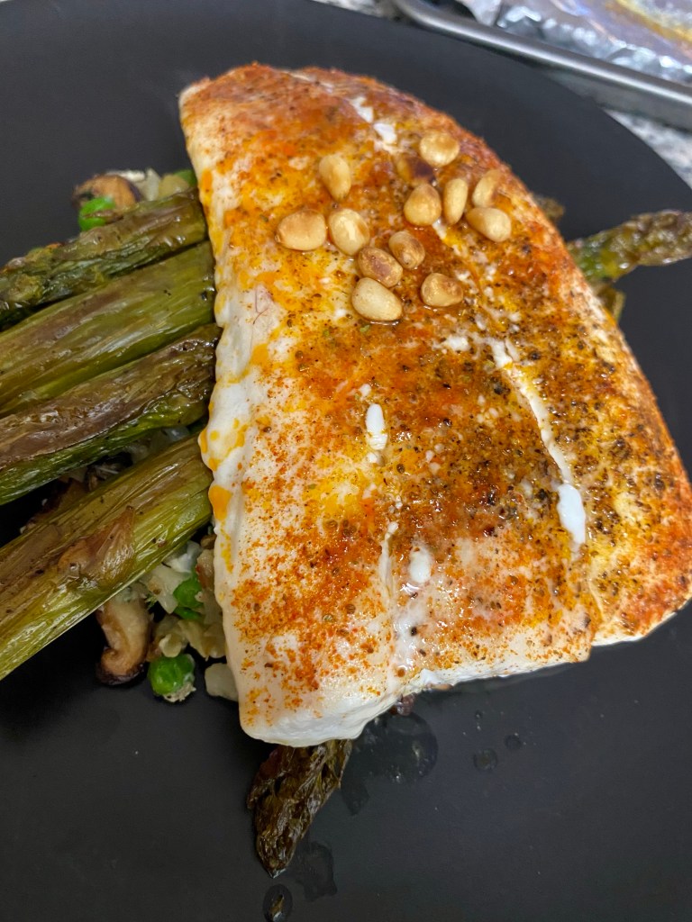 Grits just went KETO! Whaaat?! That's right! Succulent halibut filets get the cajun treatment, with cauliflower grits! It's a delicious gluten free dinner that'll have you singing for your supper! #keto #glutenfree #lowcarb #paleo #food #dinner #recipe #healthyfood #specificcarbohydratediet #cooking