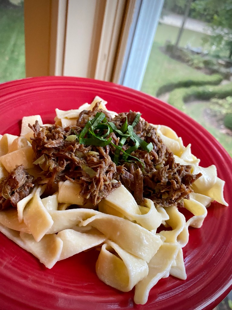 Sharing my mom's FAMOUS recipe that has been a family secret until now! BEEF OVER NOODLES! Slow cooked, melt-in-you-mouth beef - made in the crock pot - served over buttery egg noodles! An easy and delicious dinner! #keto #cooking #recipe #dinner #paleo #glutenfree #healthyfood #family #health #food
