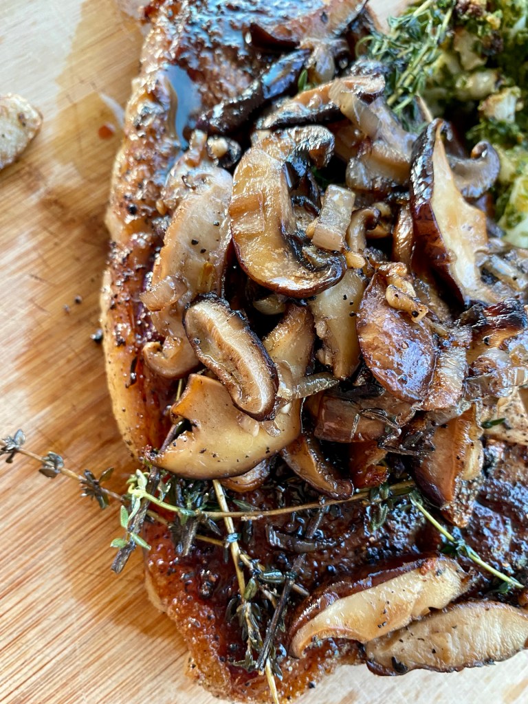 THE PERFECT STEAK! Basted with butter, thyme and garlic and seared to perfection!! Paired with pesto cauliflower, this keto date night dinner will blow you away! #glutenfree #paleo #keto #lowcarb #steak #cooking #edrecovery #food #recipes 