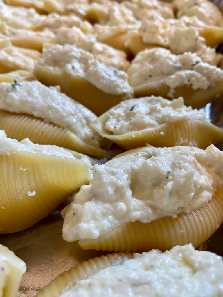 Delicious and healthy Cheesy Stuffed Shells the whole family will love! This easy weeknight dinner is great for LEFTOVERS! Which means, cook once, and enjoy all week! #food #family #recipes #pasta #italian #healthyfood #dinner 