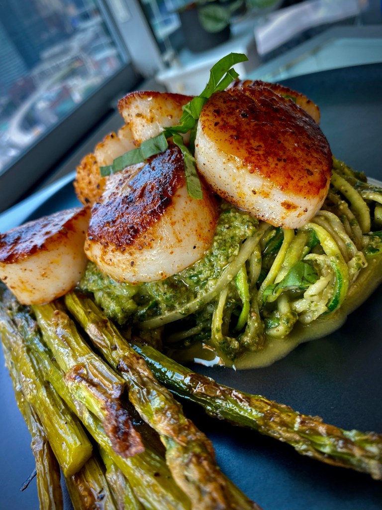 The most delicious, fast and easy dinner! Scallop Pesto Pasta! Pan seared scallops with zucchini noodles, tossed with homemade pesto — a keto and paleo dinner of dreams! Gluten free and dairy free too! #food #keto #edrecovery #cooking #recipe #paleo #pesto #glutenfree #healthyfood #cleaneating 
