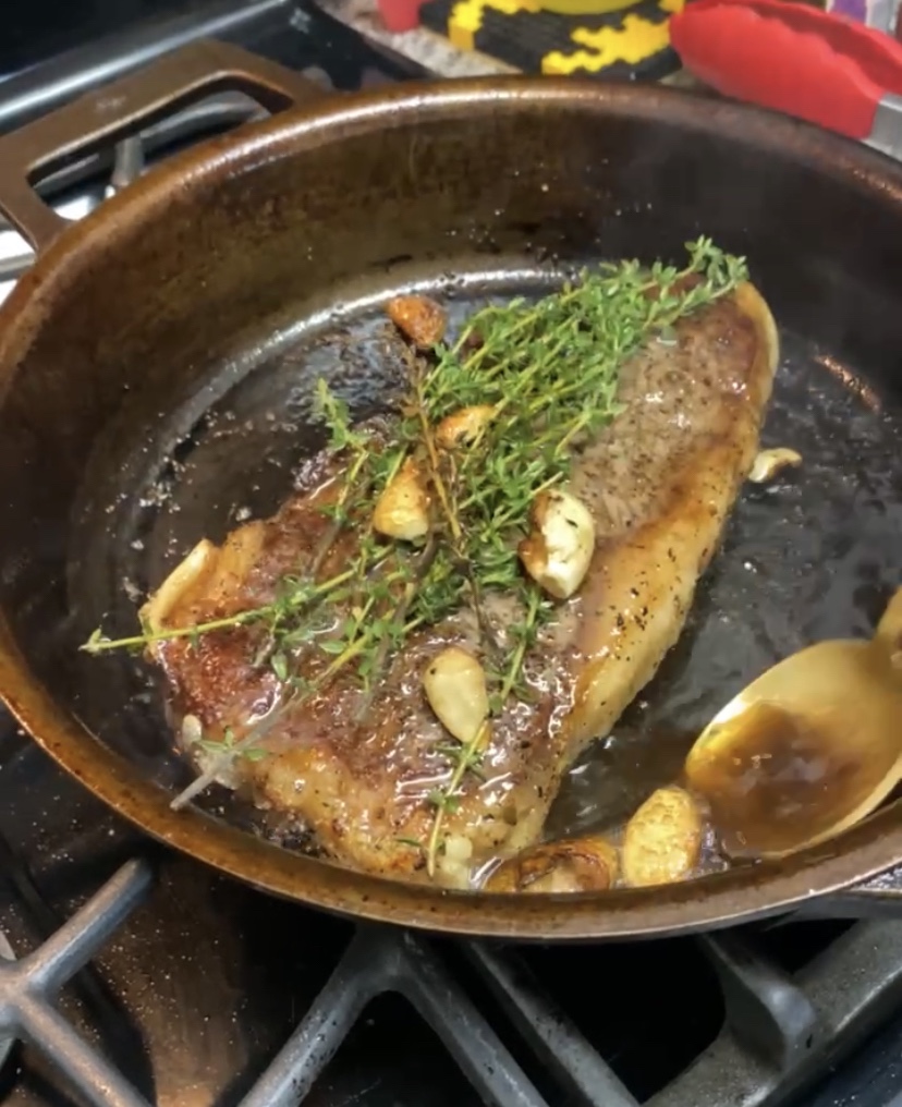 THE PERFECT STEAK! Basted with butter, thyme and garlic and seared to perfection!! Paired with pesto cauliflower, this keto date night dinner will blow you away! #glutenfree #paleo #keto #lowcarb #steak #cooking #edrecovery #food #recipes 