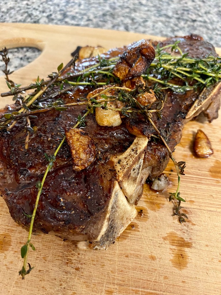 THE PERFECT STEAK! Basted with butter, thyme and garlic and seared to perfection!! Paired with pesto cauliflower, this keto date night dinner will blow you away! #glutenfree #paleo #keto #lowcarb #steak #cooking #edrecovery #food #recipes 