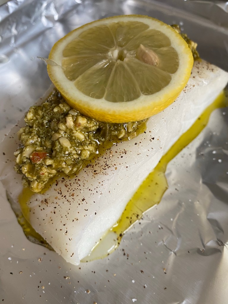 The most delicious seafood dinner! Pesto Sea Bass with Roasted Red Pepper Sauce! This gluten free #recipe is so fast and easy — and a family favorite! #food #dinner #food #cooking #glutenfree #keto #paleo #health #healthyfood 