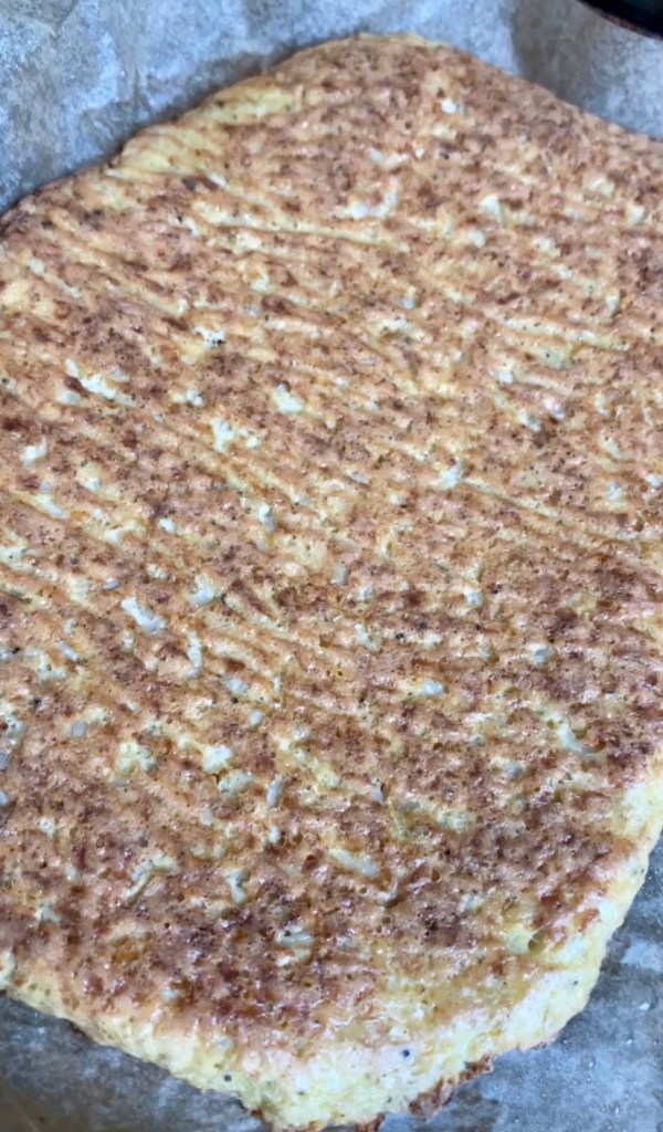 A healthy and hearty KETO pizza! Made with cauliflower and almond flour, this paleo pizza packs 68 grams of protein and is SO DELICIOUS! #glutenfree #keto #paleo #lowcarb #pizza #food #recipe #edrecovery #cooking #cauliflower