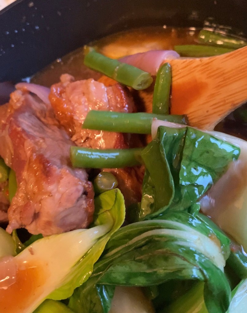 Filipino Sinigang! This healthy pork and vegetable sour soup is one of a kind, and super delicious! This traditional dish from the Philippines will be your new favorite! #food #sinigang #filipino #philippines #cooking #glutenfree #paleo #keto #soup #recipe 