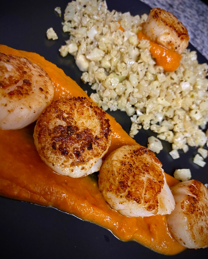 DATE NIGHT, ELEVATED! Scallops Diavolo! Italian for “devil,” this spicy red sauce pairs perfectly with pan seared scallops and cauliflower rice! This super EASY and delicious keto recipe is gorgeous, healthy, and FAST! #food #healthyfood #cooking #scallops #keto #paleo #lowcarb #glutenfree #datenight #dinner