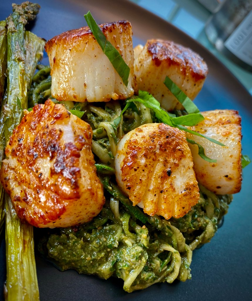 The most delicious, fast and easy dinner! Scallop Pesto Pasta! Pan seared scallops with zucchini noodles, tossed with homemade pesto — a keto and paleo dinner of dreams! Gluten free and dairy free too! #food #keto #edrecovery #cooking #recipe #paleo #pesto #glutenfree #healthyfood #cleaneating 
