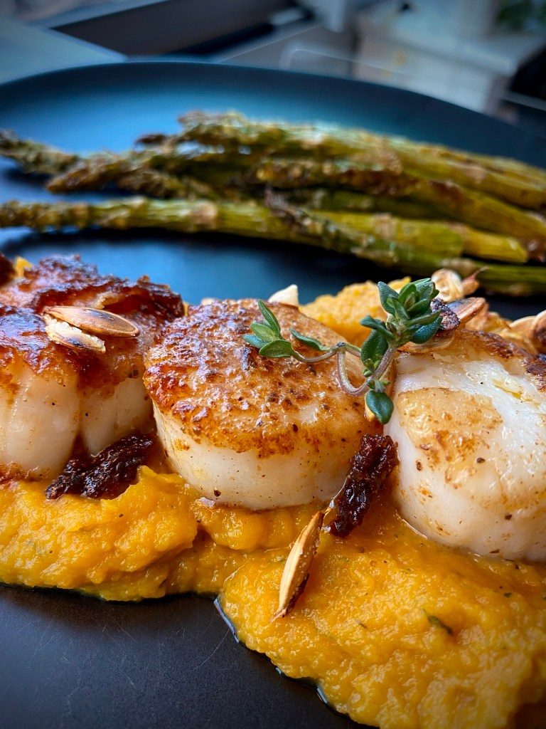 This is the BEST date night dinner! Pan seared scallops are paired with the most delicious acorn squash mash, making for a gorgeous, low carb and KETO feast! Truly restaurant quality! #food #glutenfree #dinner #keto #lowcarb #healthyfood #recipe #datenight #scallops #seafood