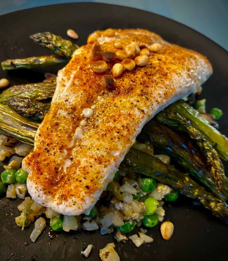 Grits just went KETO! Whaaat?! That's right! Succulent halibut filets get the cajun treatment, with cauliflower grits! It's a delicious gluten free dinner that'll have you singing for your supper! #keto #glutenfree #lowcarb #paleo #food #dinner #recipe #healthyfood #specificcarbohydratediet #cooking