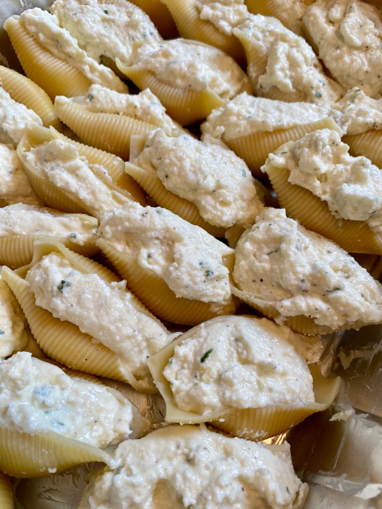 Delicious and healthy Cheesy Stuffed Shells the whole family will love! This easy weeknight dinner is great for LEFTOVERS! Which means, cook once, and enjoy all week! #food #family #recipes #pasta #italian #healthyfood #dinner 