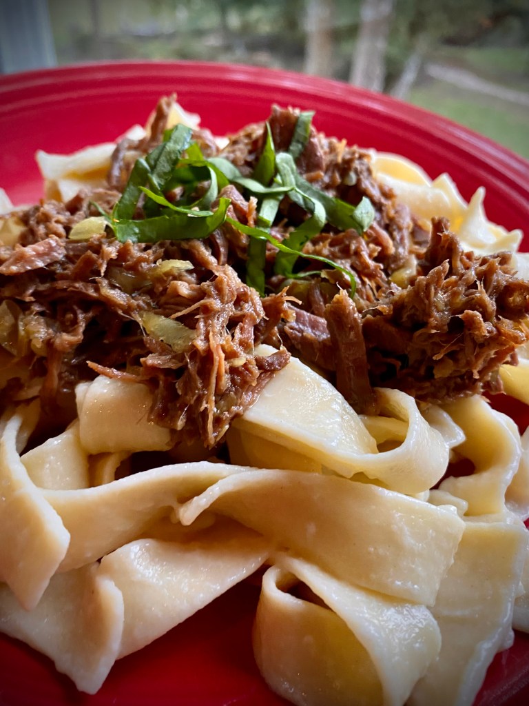 Sharing my mom's FAMOUS recipe that has been a family secret until now! BEEF OVER NOODLES! Slow cooked, melt-in-you-mouth beef - made in the crock pot - served over buttery egg noodles! An easy and delicious dinner! #keto #cooking #recipe #dinner #paleo #glutenfree #healthyfood #family #health #food