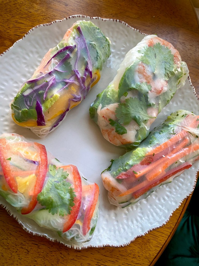 My TROPICAL SUMMER ROLLS are a healthy and deliciously FUN dinner! Not only are they beautiful to look at, but these protein packed, gluten free (with a keto option) rolls are a great way to get your kids (or picky eater) to eat their veggies! #glutenfree #lowcarb #keto #healthyfood #food #recipe #cooking #dinner #summer #springrolls