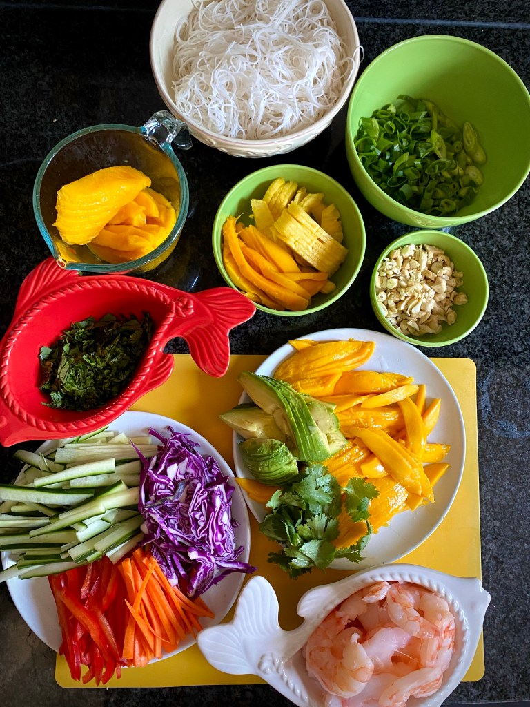 My TROPICAL SUMMER ROLLS are a healthy and deliciously FUN dinner! Not only are they beautiful to look at, but these protein packed, gluten free (with a keto option) rolls are a great way to get your kids (or picky eater) to eat their veggies! #glutenfree #lowcarb #keto #healthyfood #food #recipe #cooking #dinner #summer #springrolls