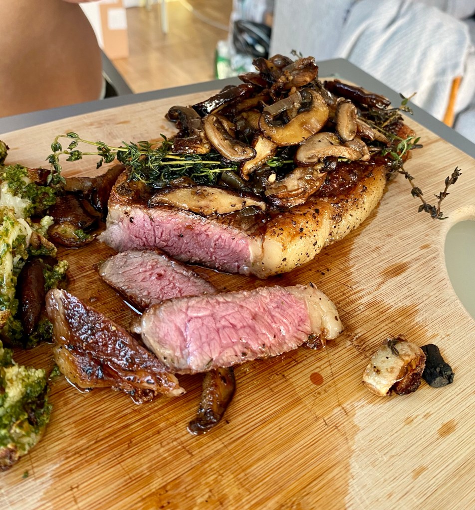THE PERFECT STEAK! Basted with butter, thyme and garlic and seared to perfection!! Paired with pesto cauliflower, this keto date night dinner will blow you away! #glutenfree #paleo #keto #lowcarb #steak #cooking #edrecovery #food #recipes 