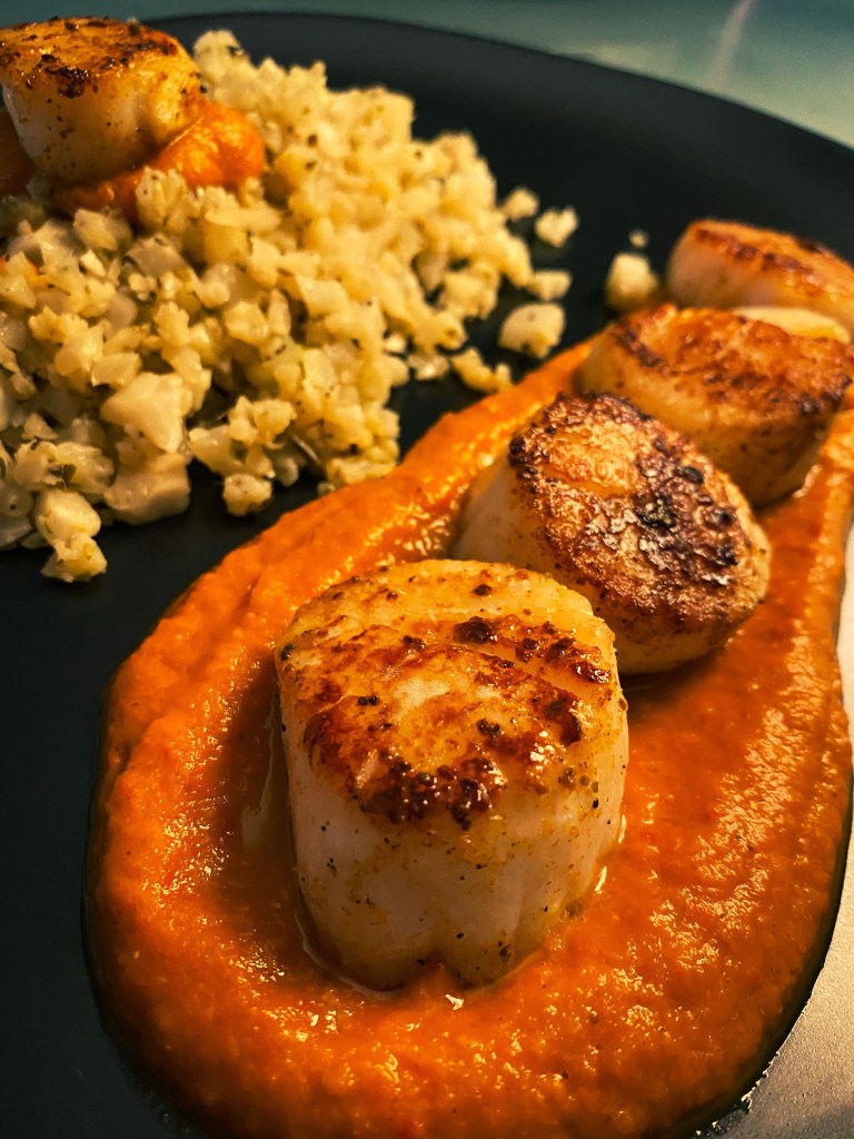 DATE NIGHT, ELEVATED! Scallops Diavolo! Italian for “devil,” this spicy red sauce pairs perfectly with pan seared scallops and cauliflower rice! This super EASY and delicious keto recipe is gorgeous, healthy, and FAST! #food #healthyfood #cooking #scallops #keto #paleo #lowcarb #glutenfree #datenight #dinner