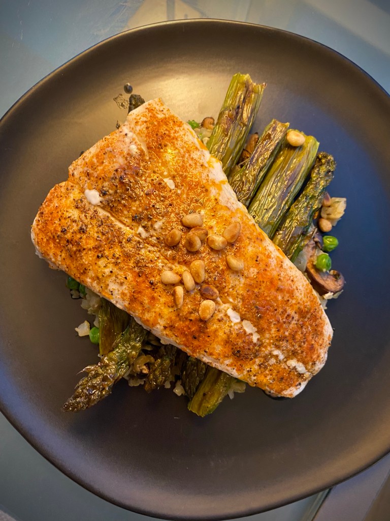 Grits just went KETO! Whaaat?! That's right! Succulent halibut filets get the cajun treatment, with cauliflower grits! It's a delicious gluten free dinner that'll have you singing for your supper! #keto #glutenfree #lowcarb #paleo #food #dinner #recipe #healthyfood #specificcarbohydratediet #cooking