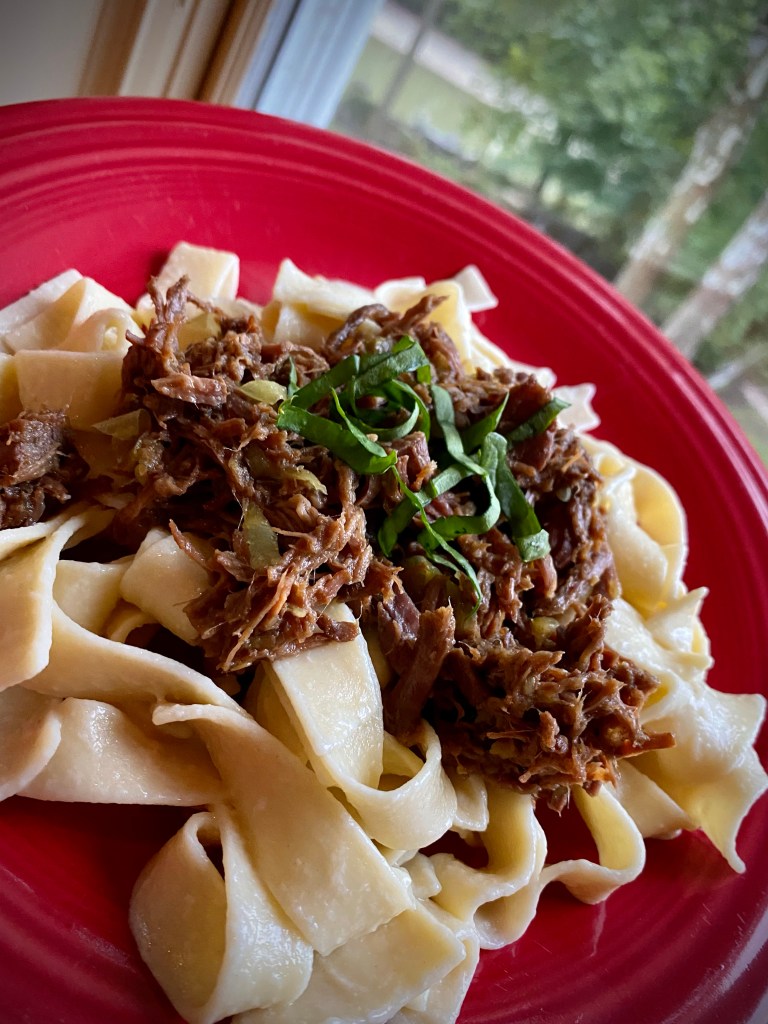 Sharing my mom's FAMOUS recipe that has been a family secret until now! BEEF OVER NOODLES! Slow cooked, melt-in-you-mouth beef - made in the crock pot - served over buttery egg noodles! An easy and delicious dinner! #keto #cooking #recipe #dinner #paleo #glutenfree #healthyfood #family #health #food