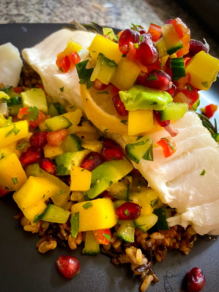 A colorful and delightfully delicious dinner! Sea Bass with Mango Pomegranate Salsa! This healthy and gluten free recipe is bursting with flavor and absolutely beautiful! A #dinner party meal for sure! #food #recipe #glutenfree #paleo #lowcarb #healthyfood #health #cooking #edrecovery