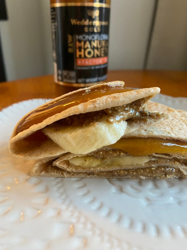 Almond butter, banana, cinnamon and Manuka Honey, snuggled inside a chewy tortilla. So xdelicious! BUT! DO YOU KNOW THE AMAZING BENEFITS OF MANUKA HONEY?! Find out! #snack #snacktime #vegetarian #glutenfree #specificcarbdiet #healthyfood #yum #cooking #recipe #food 