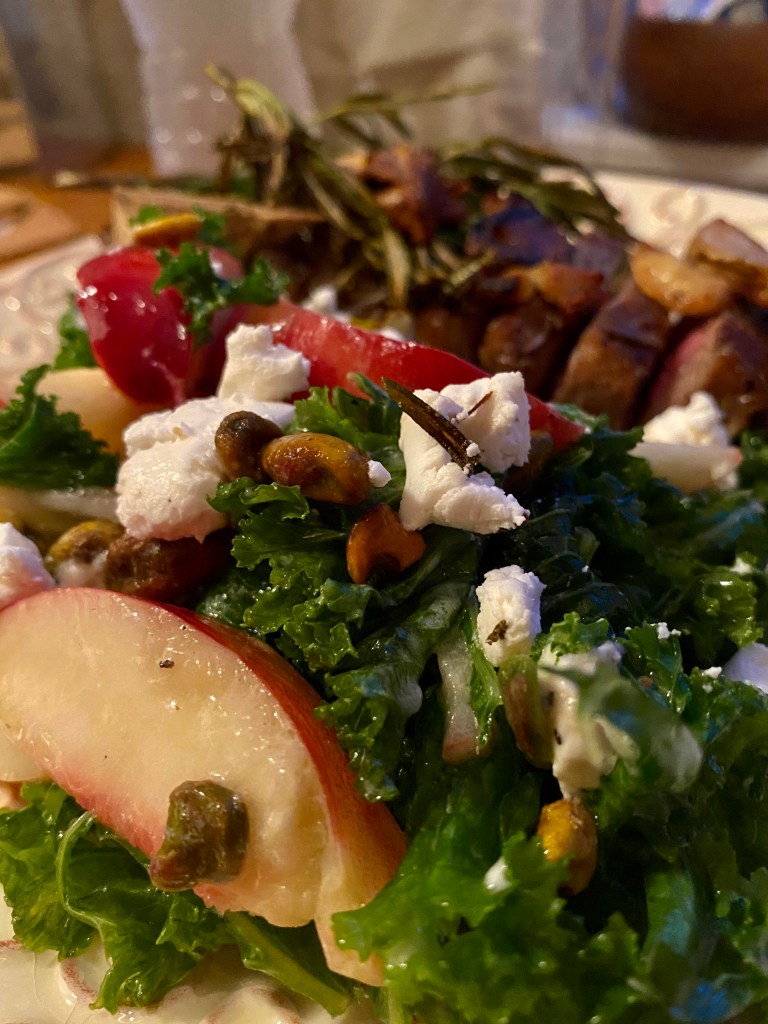 A #summer salad that is a CROWD PLEASER! Sweet, juicy peaches join forces with tangy goat cheese and crunchy pistachios in this #healthy #kale salad! Serve with a fabulous steak, and you've got a #Paleo meal for the ages! #food #recipe #glutenfree #vegetarian #lowcarb #edrecovery