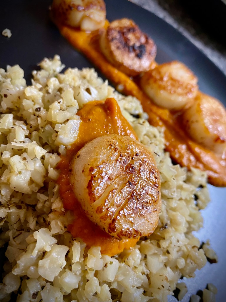 DATE NIGHT, ELEVATED! Scallops Diavolo! Italian for “devil,” this spicy red sauce pairs perfectly with pan seared scallops and cauliflower rice! This super EASY and delicious keto recipe is gorgeous, healthy, and FAST! #food #healthyfood #cooking #scallops #keto #paleo #lowcarb #glutenfree #datenight #dinner