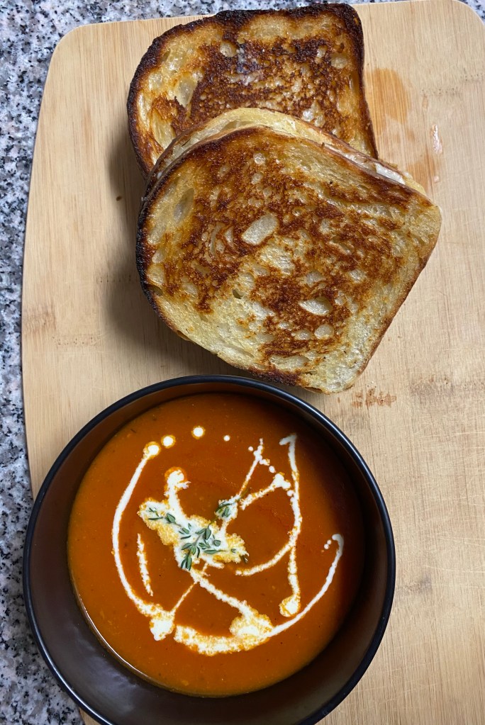 A delicious tomato soup recipe with roasted garlic! This amazing gluten free soup is healthy and packed with flavor! It will be your family’s new favorite dinner! #healthyfood #food #recipe #tomatosoup #soup #glutenfree #paleo #keto #lowcarb 