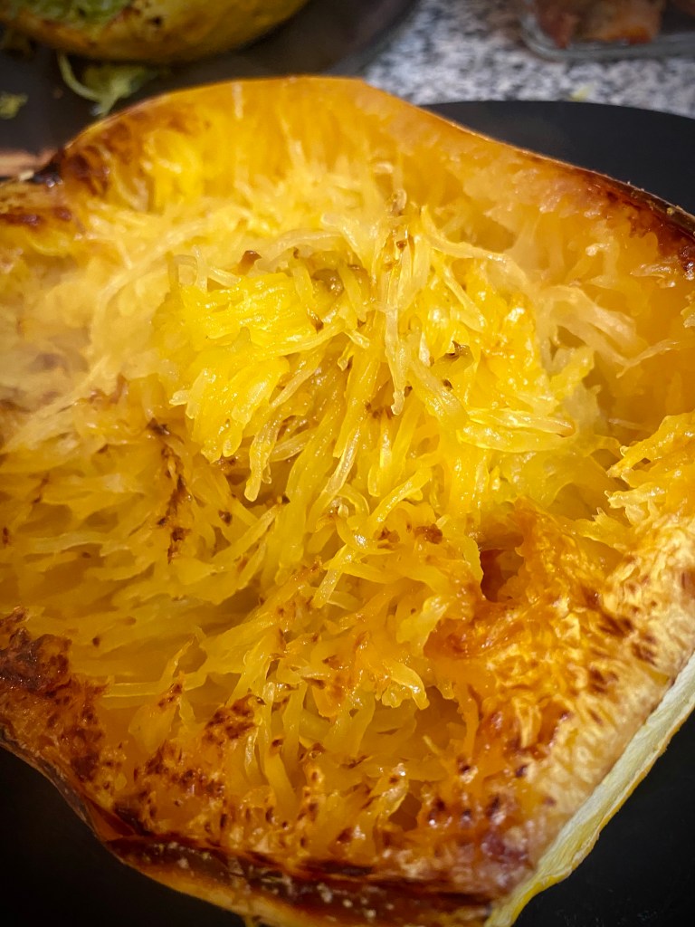 A LOW CARB *pasta dinner?!* How is that even possible!? My Spaghetti Squash boats are the most amazing #pasta alternative! Slurpy, carby and delicious - try this #keto Italian feast today! #lowcarb #glutenfree #paleo #specificcarbohydratediet #healthyfood #italian #food #recipe 