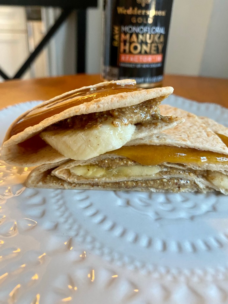 Almond butter, banana, cinnamon and Manuka Honey, snuggled inside a chewy tortilla. So xdelicious! BUT! DO YOU KNOW THE AMAZING BENEFITS OF MANUKA HONEY?! Find out! #snack #snacktime #vegetarian #glutenfree #specificcarbdiet #healthyfood #yum #cooking #recipe #food 