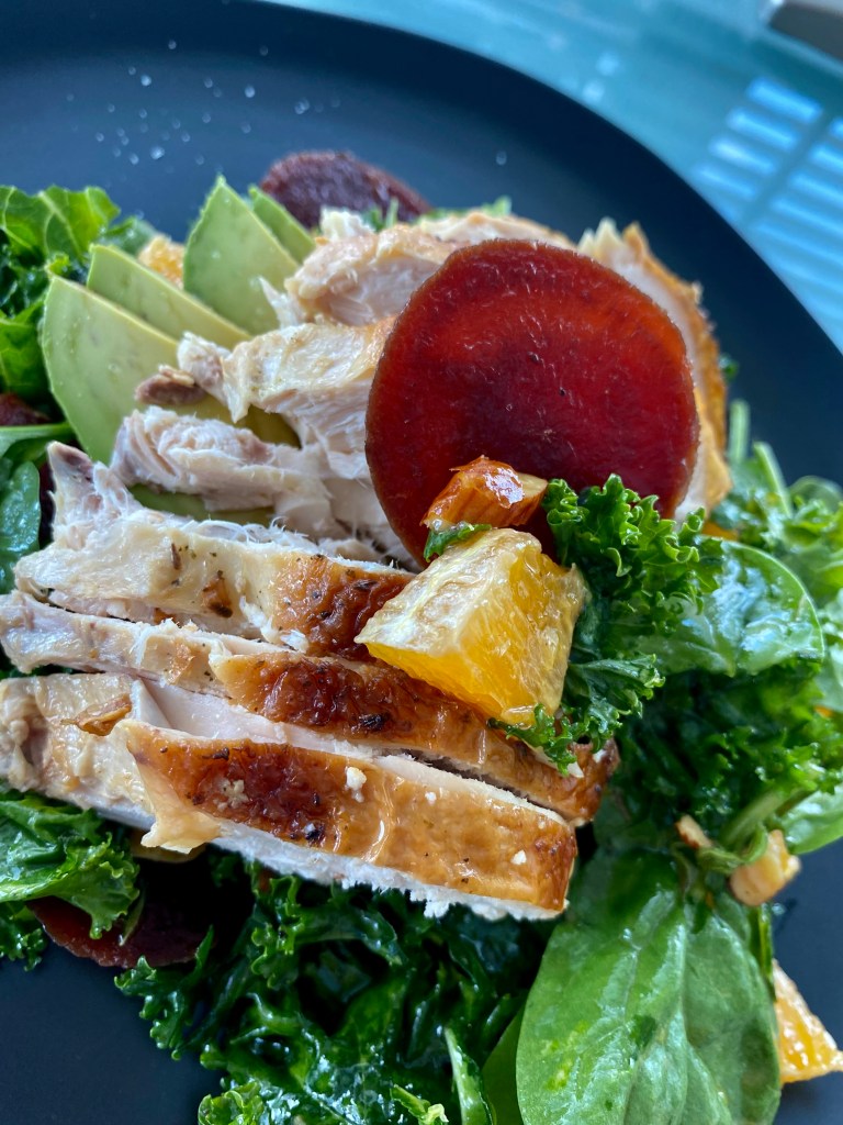An OUTRAGEOUSLY delicious recipe that's a copycat from a high-end, popular NYC brunch spot! This Citrus Chicken Kale Salad is kissed with juicy orange, buttery avocado, crunchy almonds and hearty beets! And is Keto, Paleo and Gluten Free! #healthy #food 